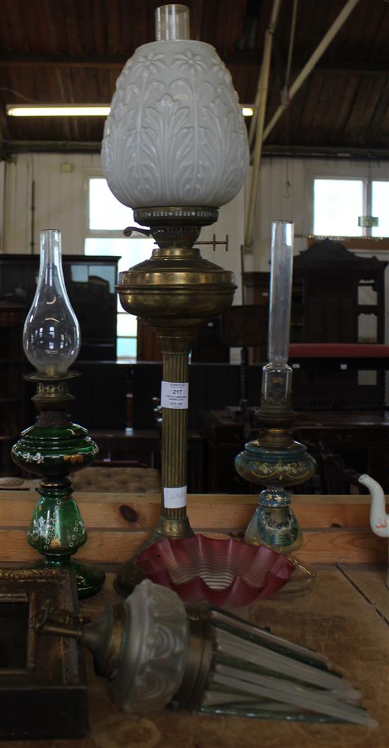 Three oil lamps and a hanging light